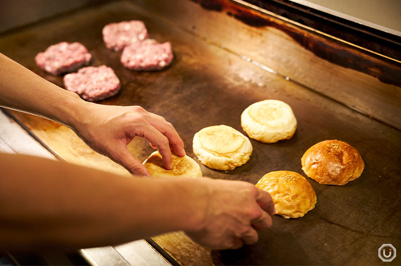 Photo of cooking burgers