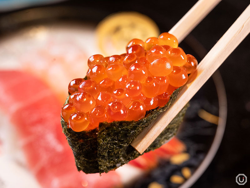 Sushi with salmon roe at Kanazawa Maimon Sushi, a conveyor-belt sushi restaurant in Shibuya