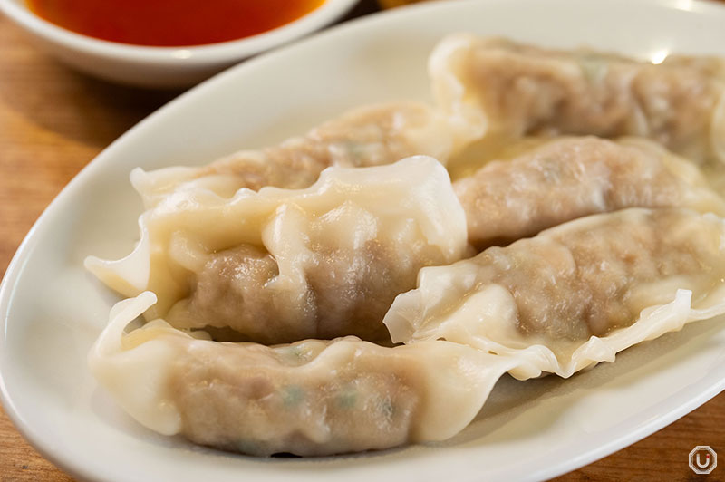 Addicting Gyoza Dumplings drizzled with chili oil