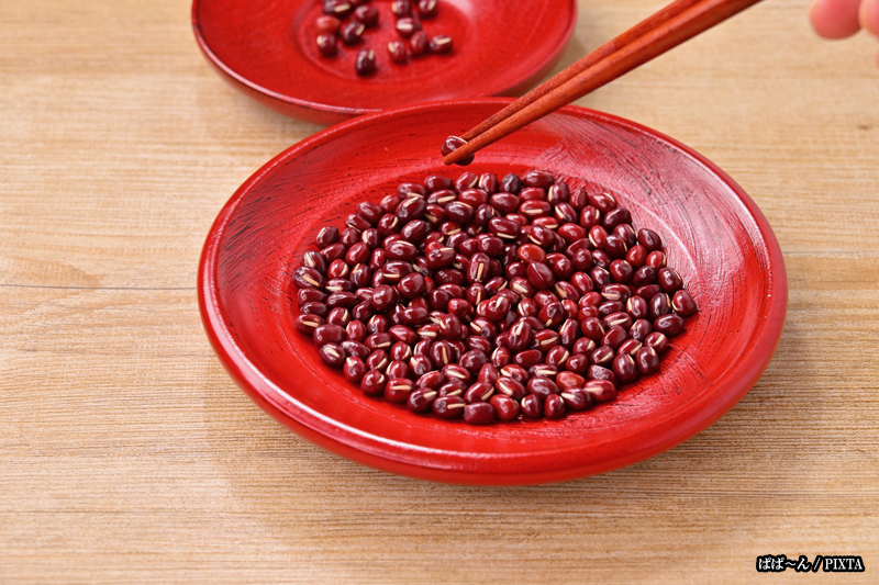 bowl of beans with chopsticks