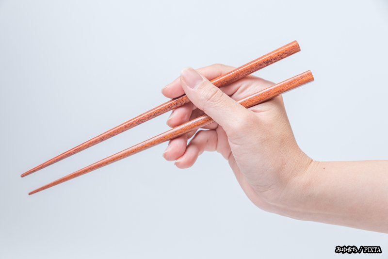 holding chopsticks