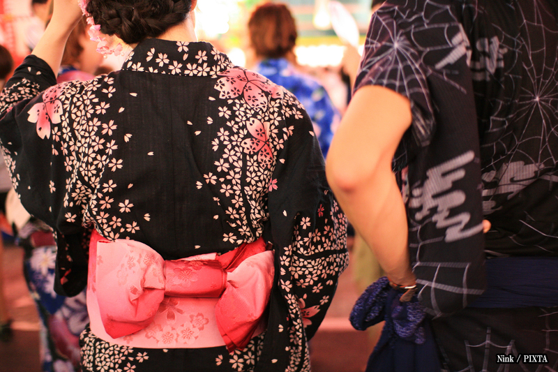 Japanese people wearing yukata at a matsuri