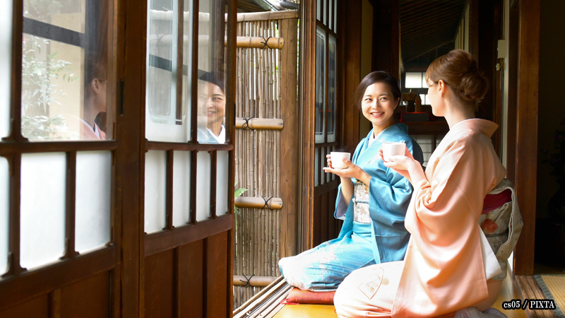 international tourist wearing and japanese woman wearing kimono at a ryokan
