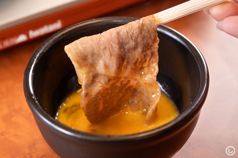 Sukiyaki dipped in raw egg