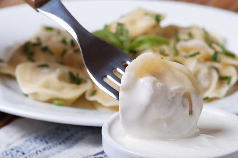Pelmeni with sour cream image