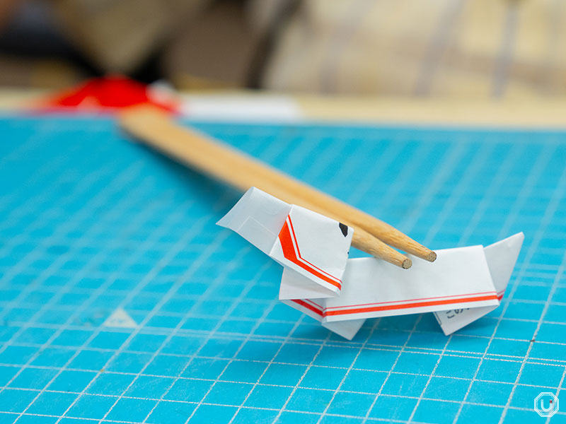 Origami dog chopstick rest made by Kazuo Kobayashi